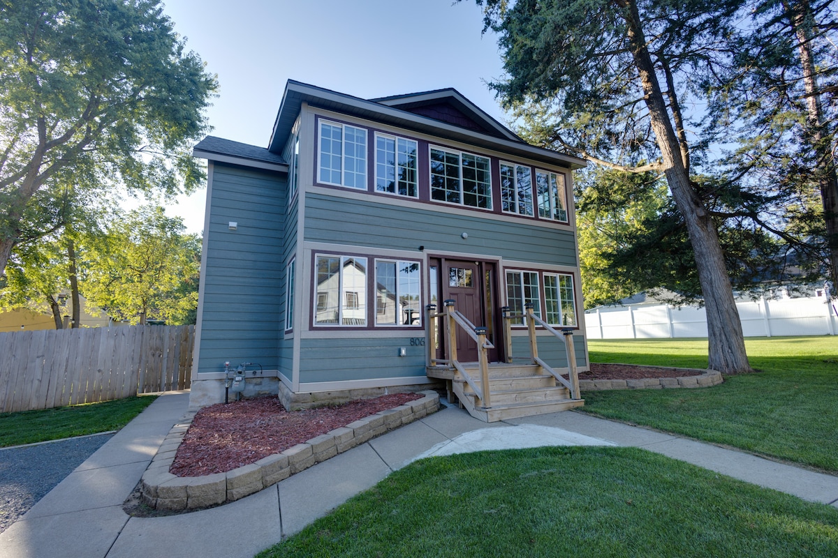 Hidden Gem's blue-green exterior and sunny lawn