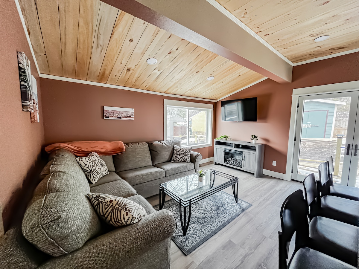 The Hidden Gem — Main Level Living Room (full size sofa bed) with TV with Amazon Firestickand electric fireplace.
